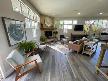 A living room with a fireplace and a flat screen TV.